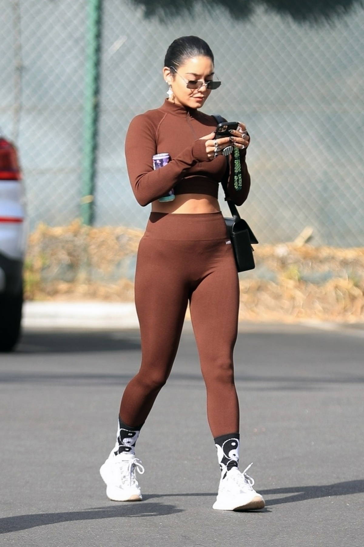 Vanessa Hudgens shows off her toned body in brown leggings and workout top  as she hits