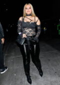 Bebe Rexha stuns in all-black lace top and leather pants while