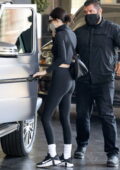 Kendall Jenner shows off her svelte figure in all-black crop top and  leggings while out
