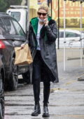 Ashely Benson takes G-Eazy's Range Rover as she steps out for some coffee and snacks on a rainy day in Los Angeles