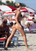 Candice Swanepoel looks sensational in a black bikini as she hits the beach  with friends in