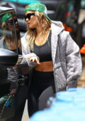 Rita Ora rocks a Louis Vuitton hoodie with black crop top and