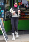 Vanessa Hudgens wears a two-toned sweater, leggings and platform sneakers during a juice run in Los Angeles