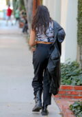 Eva Longoria sports a form-fitting black top with leggings while