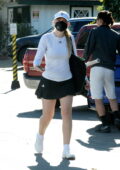 Dakota Fanning puts on a leggy display as she leaves after her tennis lessons in Los Angeles
