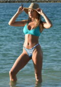Georgia Harrison slips into a bikini while enjoying the beach in Portugal