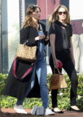 Katherine Schwarzenegger shows her baby bump while out shopping with a friend in Los Angeles