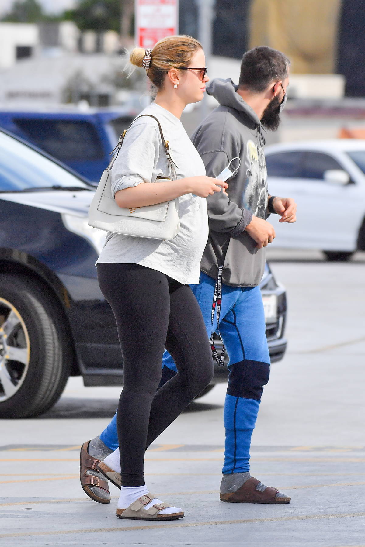 mia goth shows her huge baby bump in a white tee and navy blue leggings  while out for walk in los angeles-180322_14