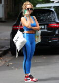 Alessandra Ambrosio sports a crop top and flared leggings while
