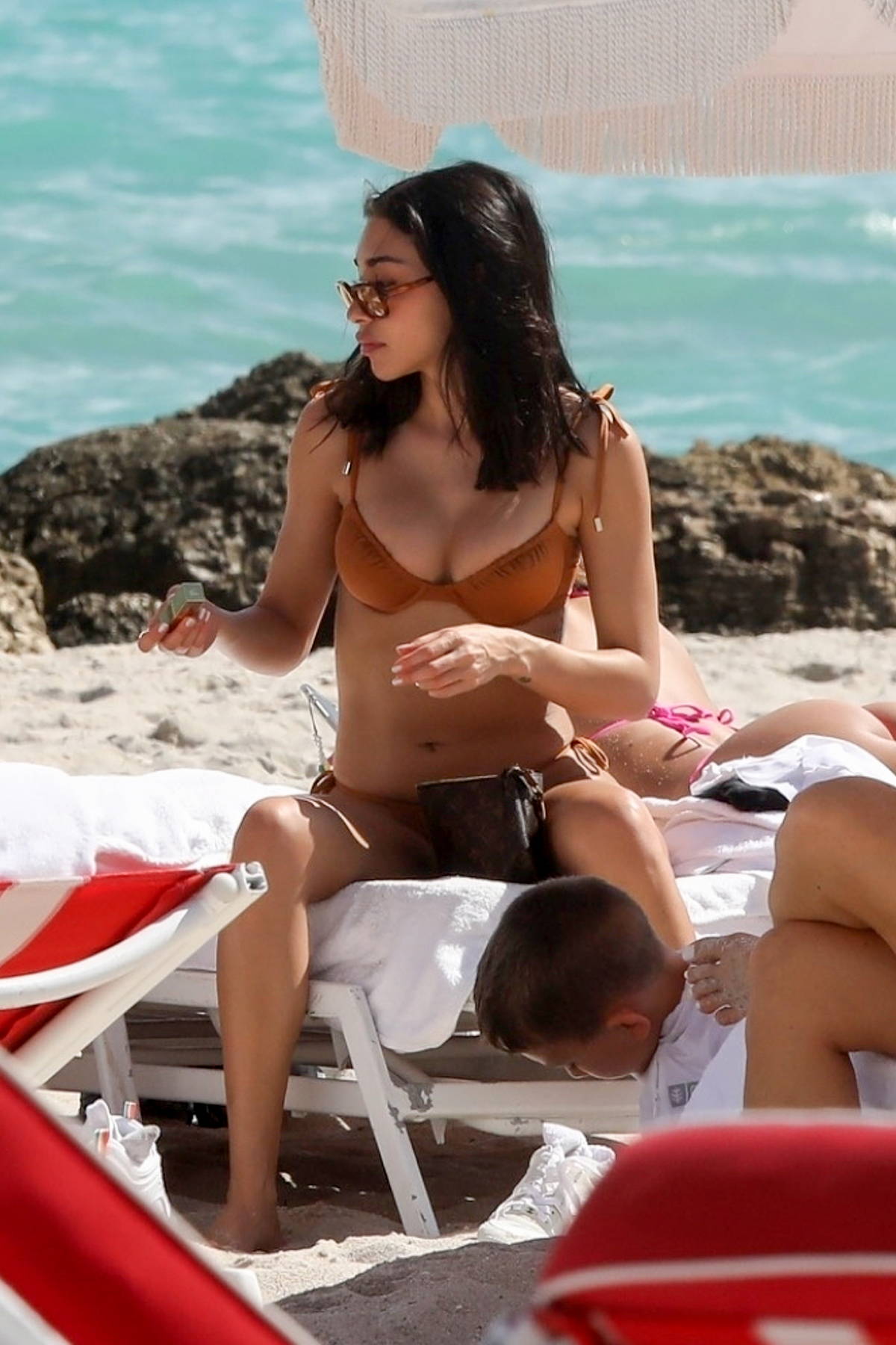 Chantel Jeffries rocks a patterned Louis Vuitton bikini while enjoying a  beach day with friends in