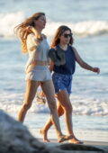 Gisele Bundchen displays her supermodel legs while enjoying an evening stroll on the beach with a friend in Costa Rica