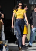 Kendall Jenner looks cute in a yellow crop top and jeans while spotted on  the set