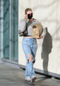 Lili Reinhart wears a cropped sweater and ripped jeans while she picks up lunch to-go in Vancouver, Canada