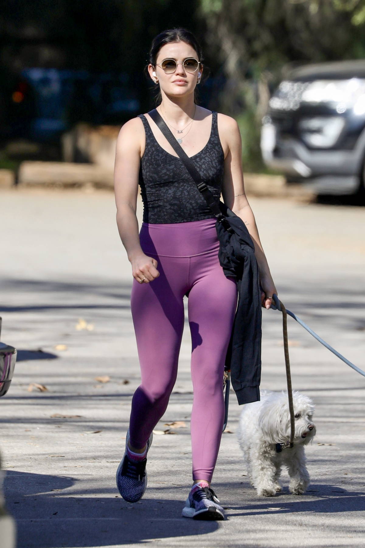 Lucy Hale displays her athletic figure in patterned tank top and leggings  while attending a hot