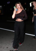 Madelyn Cline looks fab in all-black while enjoying a night out at The Nice Guy in West Hollywood, California