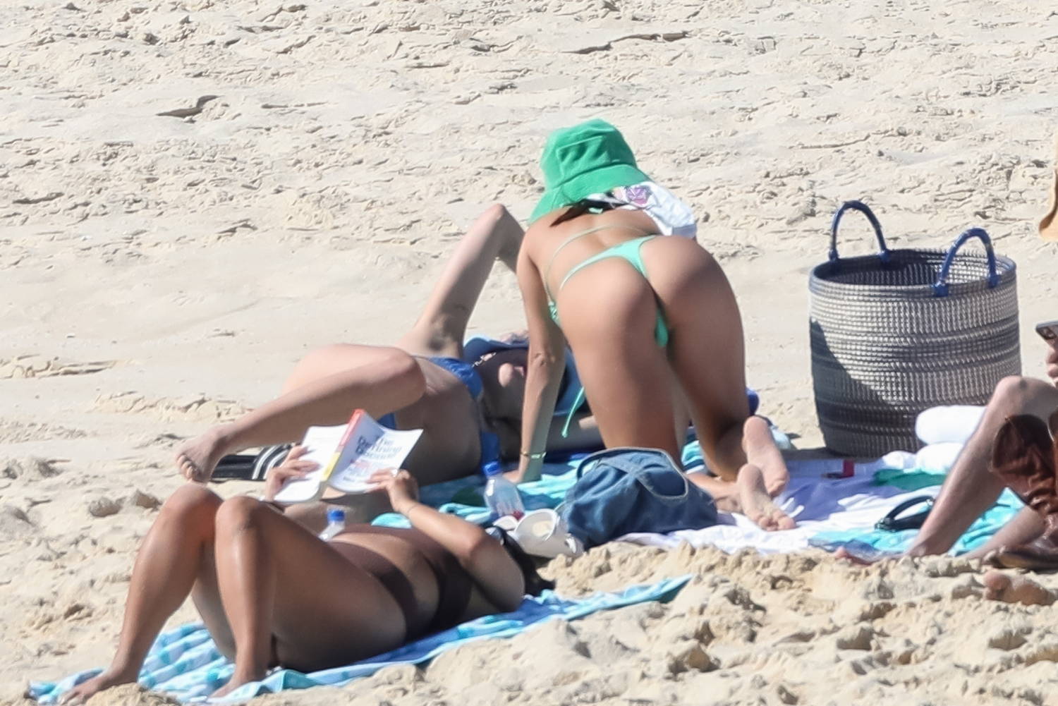 Vanessa Hudgens showcases her figure in neon green thong bikini and hat at  the beach in Mexico
