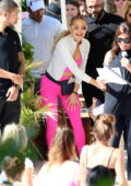 kate hudson stands out in hot pink crop top and leggings while