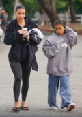 Kim Kardashian opts for a black hoodie and leggings as she attends her son Saint's soccer game in Los Angeles