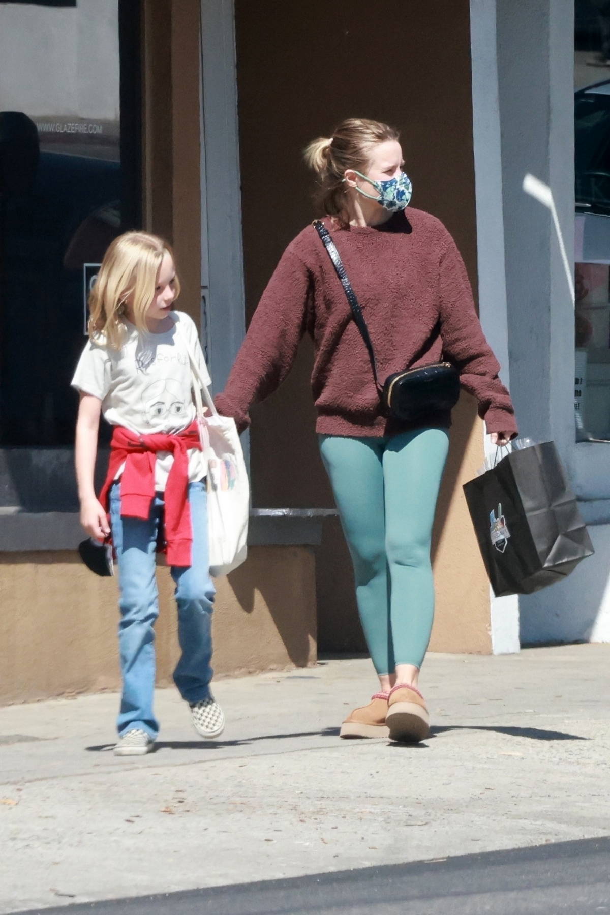 Kristen Bell wears a colorful knitted sweater while out to pickup her  daughter from school in