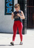 Lucy Hale leaves her Pilates class sporting a 'Harley Davidson' tank top and red leggings in Studio City, California