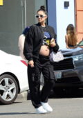 Shay Mitchell bares her baby bump in a cropped t-shirt while out running errands in Los Angeles