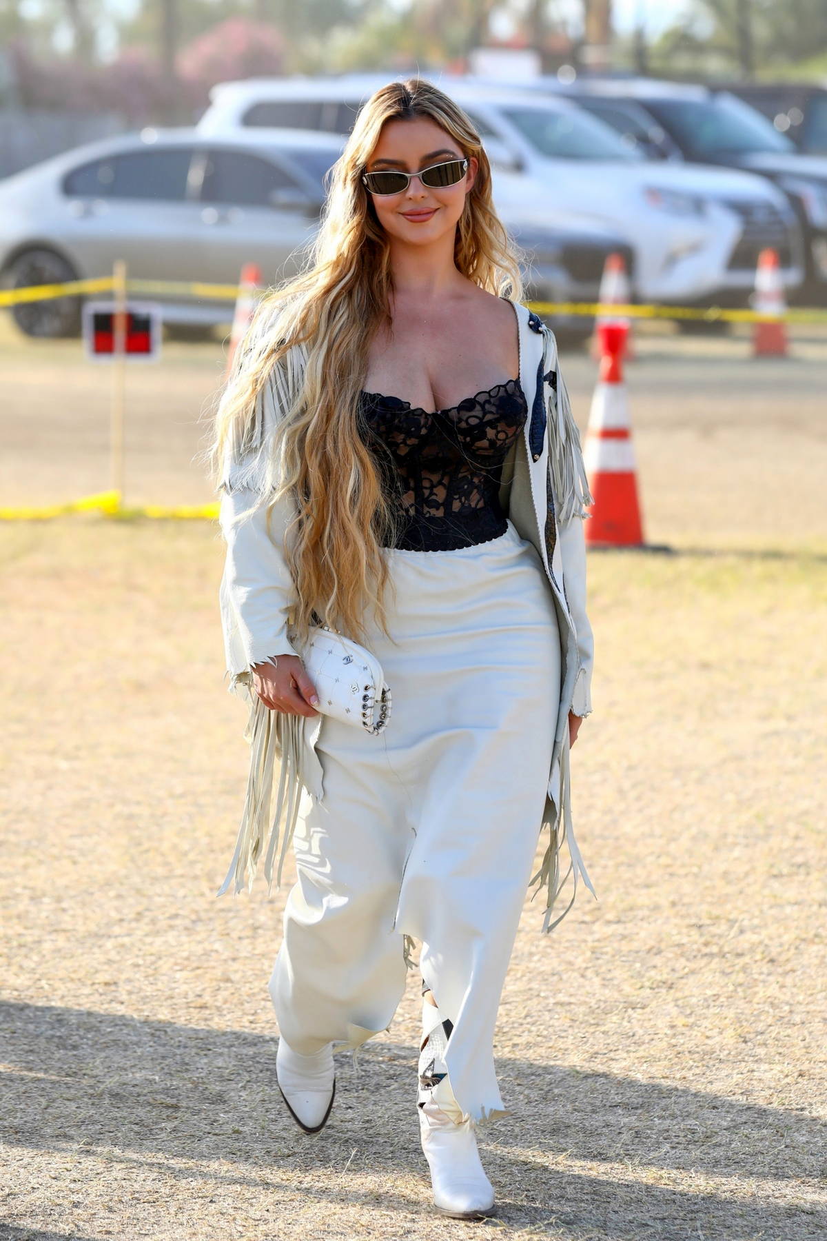 https://www.celebsfirst.com/wp-content/uploads/2022/04/demi-rose-stuns-in-a-plunging-corset-top-while-attending-week-2-day-3-of-2022-coachella-in-indio-california-240422_5.jpg