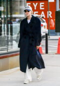 Gigi Hadid bundles up in a trench coat while out for a walk around SoHo in New York City