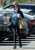 Kaia Gerber wears a hoodie and leggings for a coffee run at Erewhon in Studio City, California