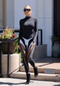 Khloe Kardashian rocks a black bodysuit and leggings for lunch at