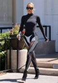 Khloe Kardashian rocks a black bodysuit and leggings for lunch at