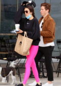 Nina Dobrev sports hot pink leggings while stepping out for lunch with boyfriend Shaun White in Thessaloniki, Greece