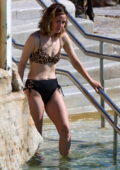 Rose Byrne looks great in an animal print bikini while she goes for a swim in Sydney, Australia