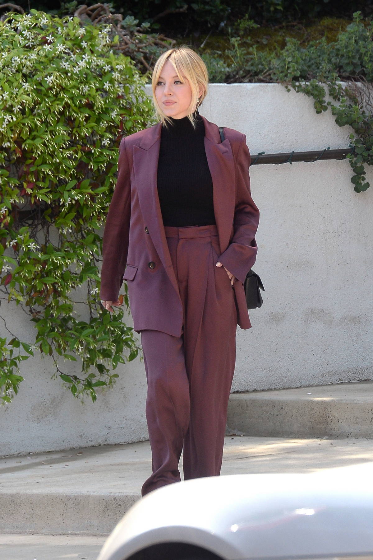 Sydney Sweeney looks chic in a burgundy suit while stepping out in Los