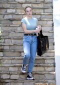 Sydney Sweeney looks radiant as she steps out wearing a blue tee and jeans in Los Angeles