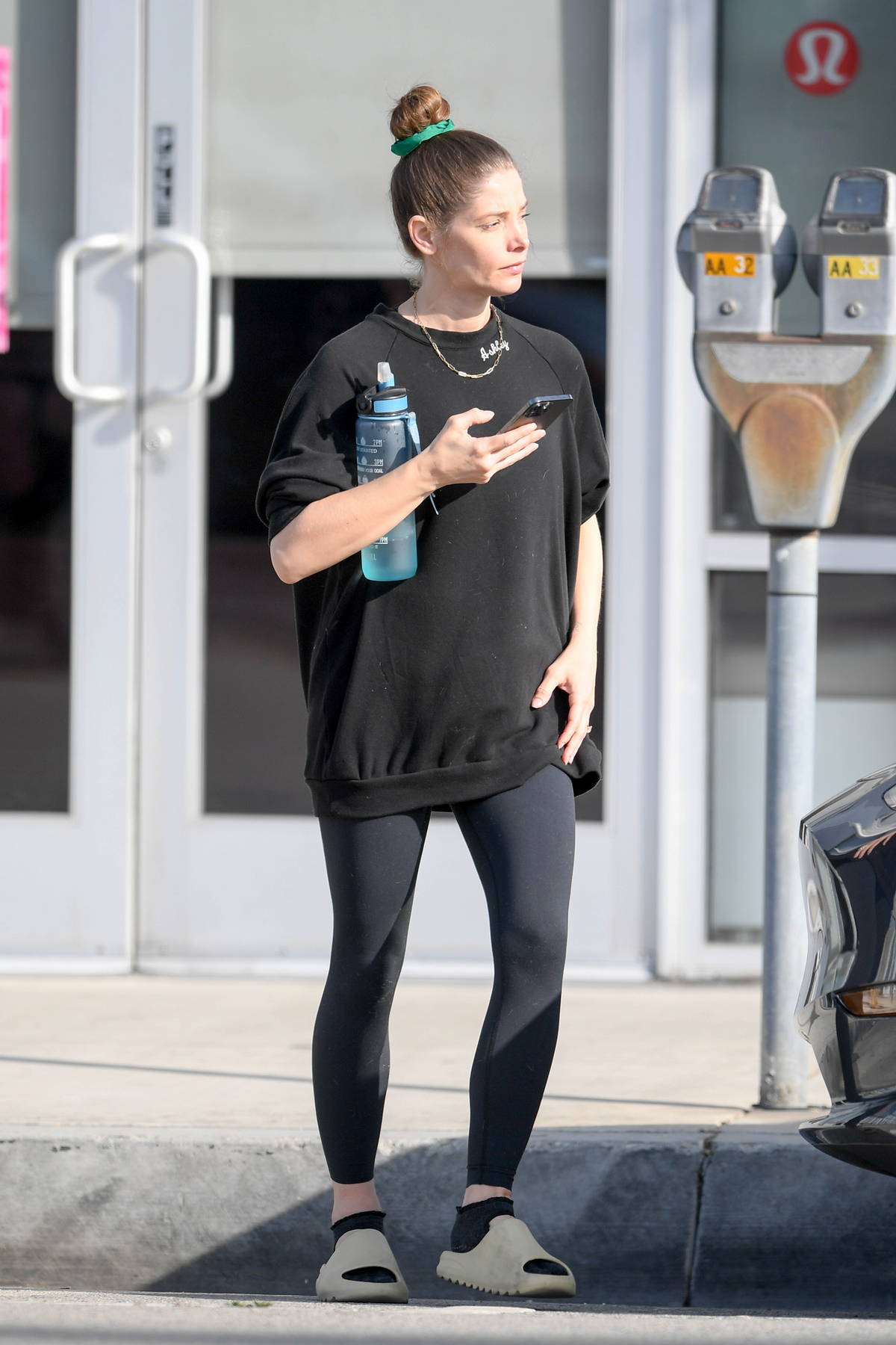 Ashley Greene shows her baby bump in an oversized t-shirt and leggings as  she hits