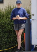 Elizabeth Olsen opts for a Reebok sweatshirt and shorts while making a coffee run with Robbie Arnett in Los Angeles