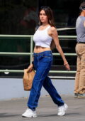 Madison Beer bares her toned midriff in a crop top while out shopping at a local farmer's market in Los Angeles