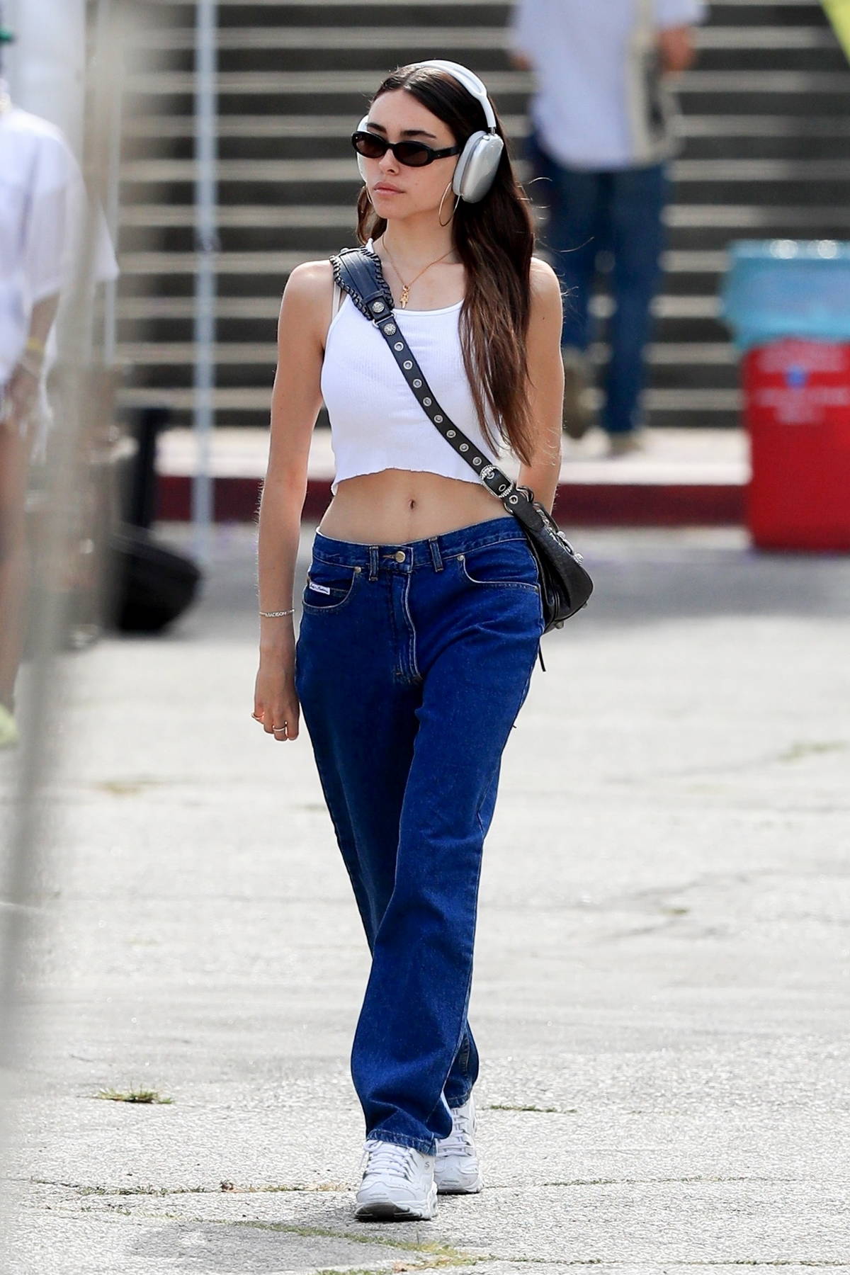 Madison Beer shows off toned tum in cropped top and Burberry trousers