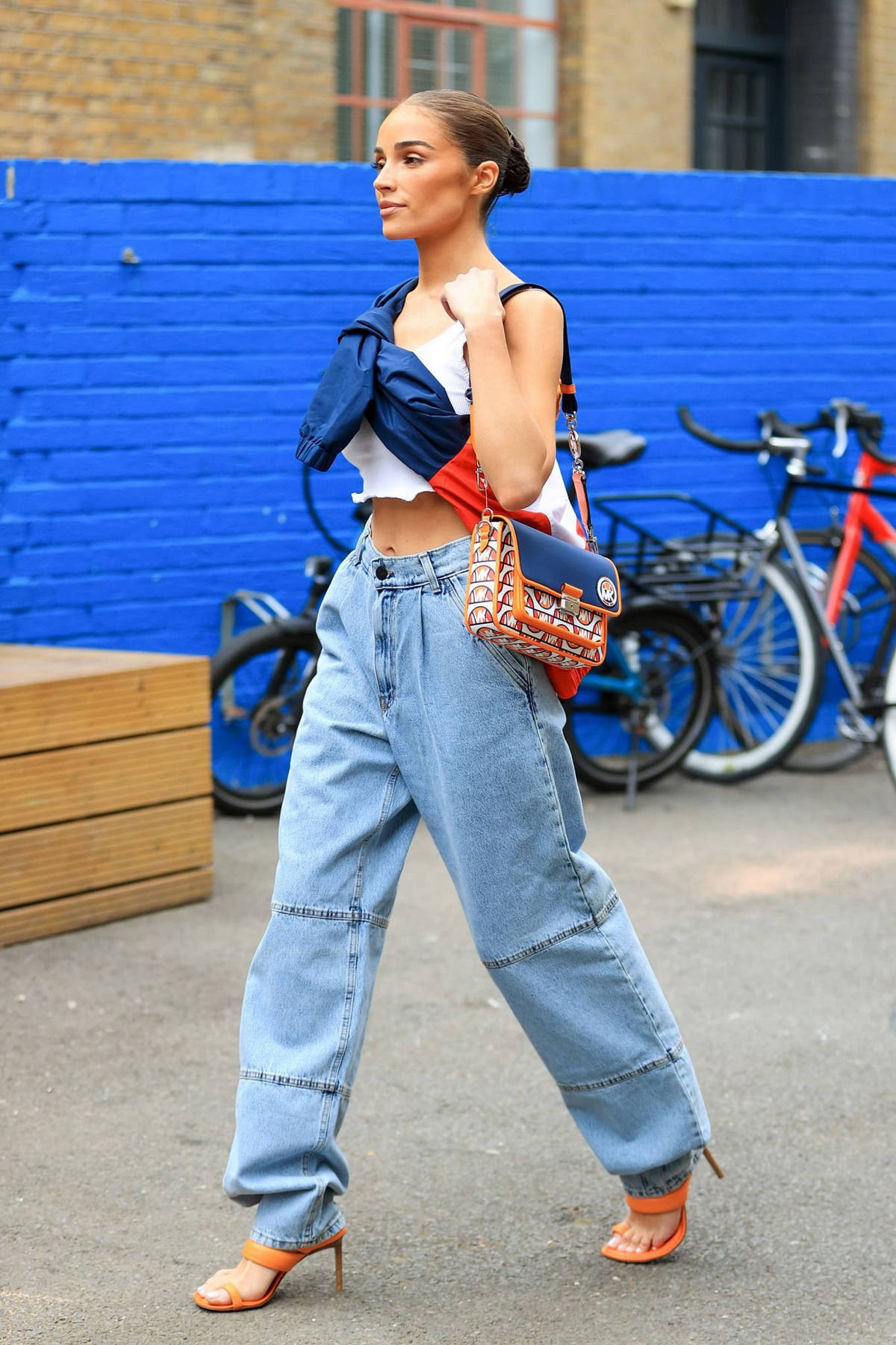 olivia looks trendy in a white crop top and baggy jeans while out in london, uk-040522_3