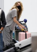 Shailene Woodley keeps it comfy in a grey tee and sweatpants as she arrives at LAX in Los Angeles