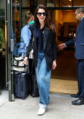 Anne Hathaway looks chic in a black blazer, jeans and sneakers while leaving her hotel in New York City