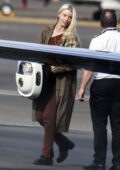 Anya Taylor-Joy carries her cat in a hard-shell backpack as she touches down in Sydney, Australia