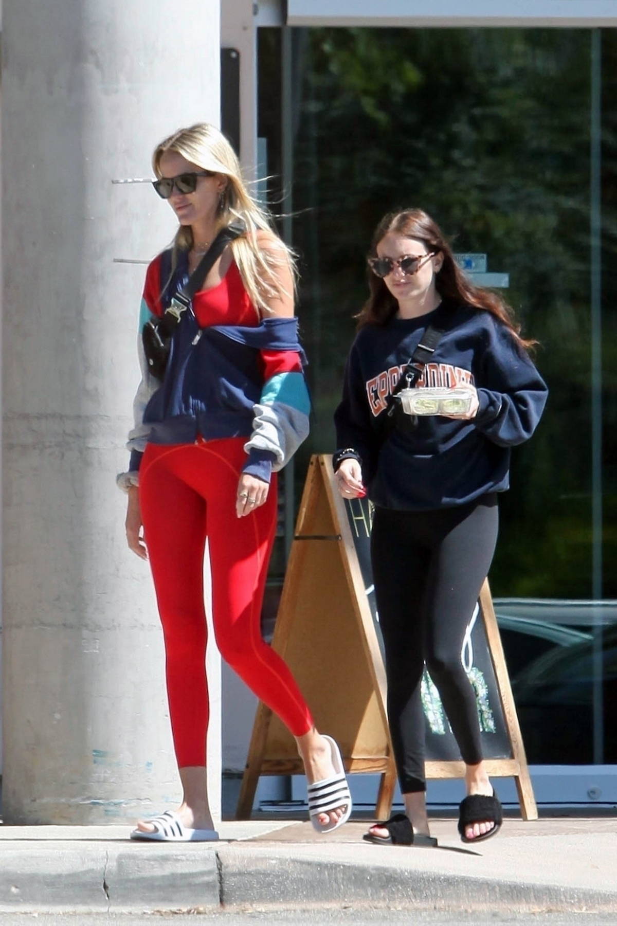 ava phillippe looks great in a red sports bra and leggings while