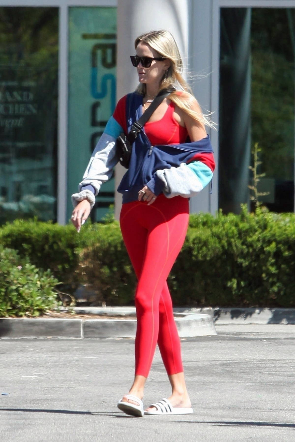 Ava Phillippe looks great in a red sports bra and leggings while