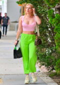 Bella Thorne looks pretty in a pink top paired with neon green pants while  stepping out