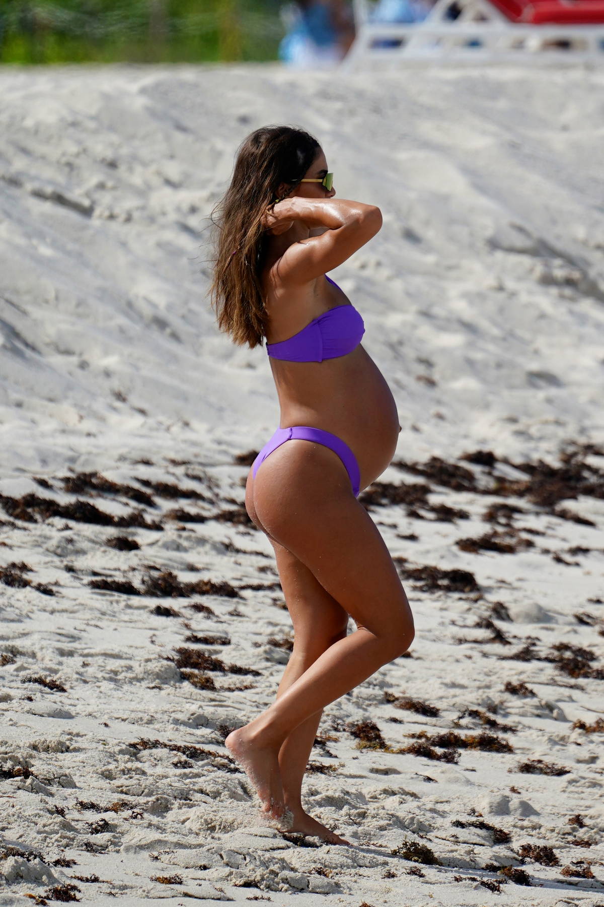 camila coelho bares her growing baby bump in a purple bikini at