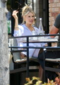 Charlotte McKinney is all smiles as she grabs alfresco lunch with a friend in Pacific Palisades, California