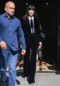 Dakota Johnson wears a black velvet pantsuit as she leaves the Greenwich Hotel in New York City