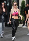 Halsey flaunts her toned midriff in a pink crop top and black leather pants while out shopping at Ulta Beauty in New York City