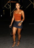 Karrueche Tran gets leggy in a tiny denim skirt while attending the opening of Catch Steak LA in West Hollywood, California